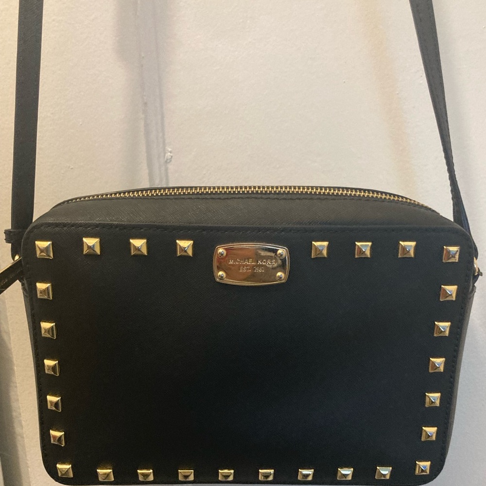 Black and gold studded Micheal Kors cross body purse